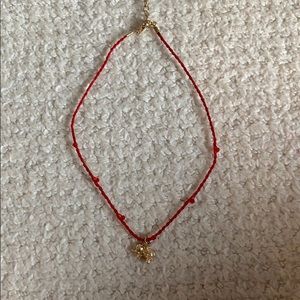 red chocker with gold elephant